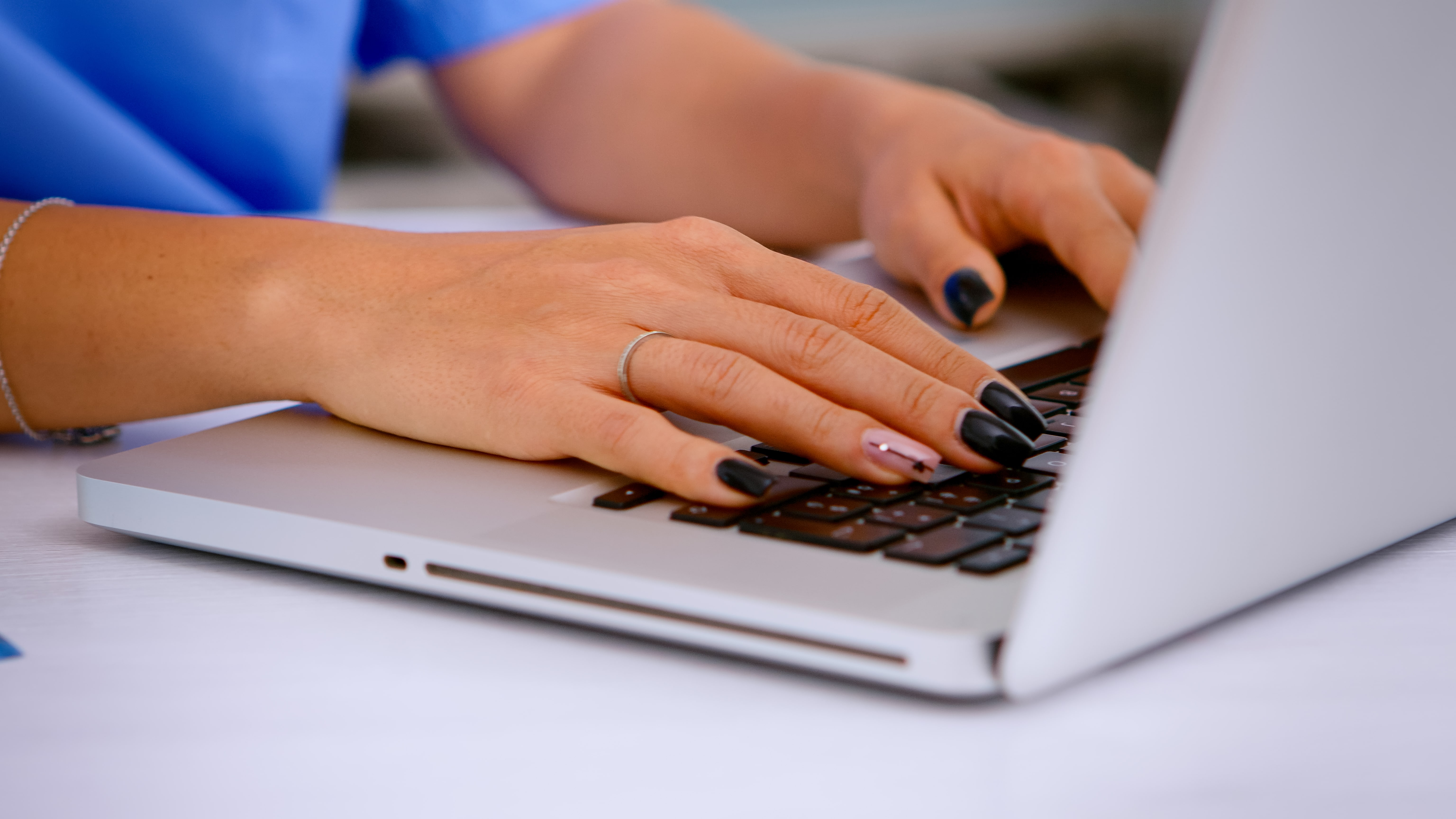 close-up-woman-nurse-typing-patient-health-report-laptop-keyboard-making-appointments-medical-clinic-patient-registration-healthcare-physician-medicine-uniform-writing-treatments
